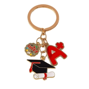 Gold graduation keychain featuring lucky charm, academic A plus, and a graduation cap