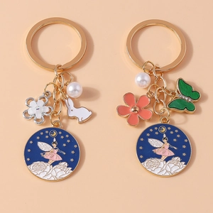 Porte-clés de Mode en Alliage Émail Fée Avec Pendentif Künstliche Perle Fleur Lapin Bleu Ciel Étoilé Danseuse de Ballet Bijoux de Sac