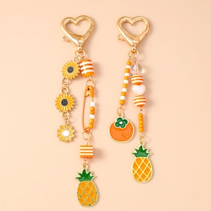 Süßer Perlenanhänger mit Ananas und Blume Anhängern in lebendigem Orange und Gold