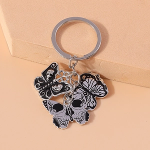 Gothic skull butterfly keychain with black white enamel charms on silver metal ring