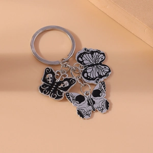 Gothic skull and butterfly keychain with black enamel alloy charms for bags and keys