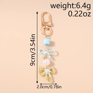 Détails du porte-clés perles avec nœud bleu montrant les dimensions de 9cm de long
