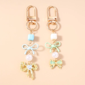 Élégant Porte-Clés en Alliage Nœud Papillon Künstliche Perle Doux Pendentif de Sac Charm Ruban Cœur Nœud Porte-Clés Cadeau pour Femme