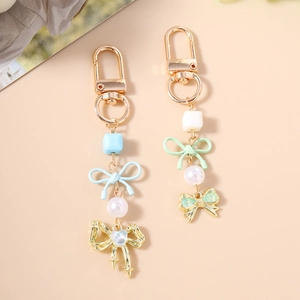 Porte-clés élégant en perles avec nœud papillon et blocs colorés en bleu et vert