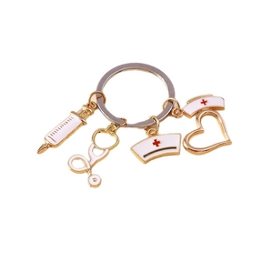 Nurse medical keychain with gold heart, syringe, stethoscope and nurse hat charms
