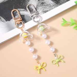 Détails de pendentifs porte-clés muguet avec perles et nœuds colorés élégants