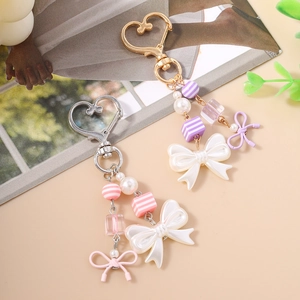 Chic beaded keychain with pearls and bow charms in candy colors for bags and keys