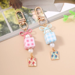 Sweet checkered cube keychain with ribbon bow, faux pearl, and gold lobster clasp