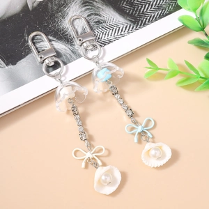 Porte-clés méduse tendance avec chaîne en strass, nœud et pendentif perle pour sacs