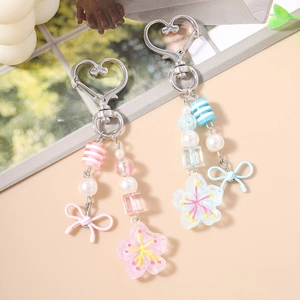 Portachiavi con perline di fiori di ciliegio in rosa e blu con perle striate