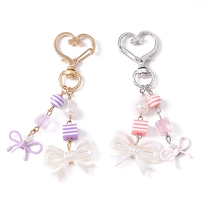 Fashionable heart-shaped keychain with pearls, striped beads, and cute bow tie pendants