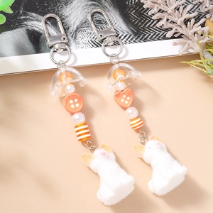 Porte-clés mignon perlé à la main avec breloque animal peluche blanche et perles