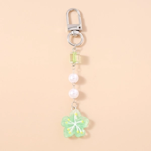 Detail of green cherry blossom pendant with white pearls and silver snap hook