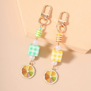 Summer fruit bead keychain with pearl accents and lemon slice charm in bright colors