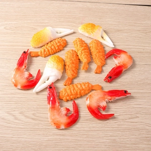 Detailed view of realistic resin food charms including shrimp and crab for DIY crafts