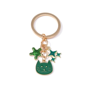 Portachiavi gatto e stella marina dorato con smalto verde per borse e accessori moda