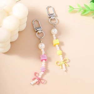 Cute pearl bead keychain pendants with bowknots and striped beads in pink and yellow