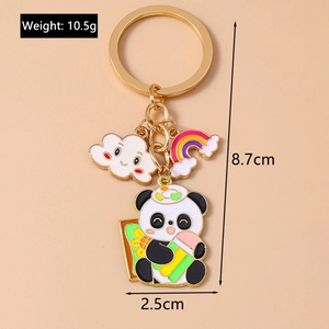 Detailed size view of golden panda keychain with rainbow and cloud charms, 8.7cm height