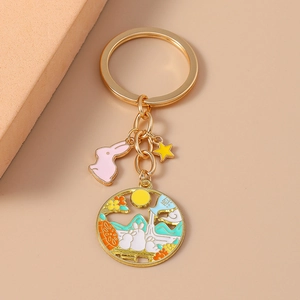 Chinese style rabbit keychain with golden bunny, star, and circular enamel mooncake pendant