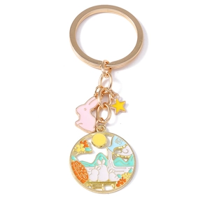 Traditional Chinese style jade rabbit keychain with enamel moon and star charms in gold finish