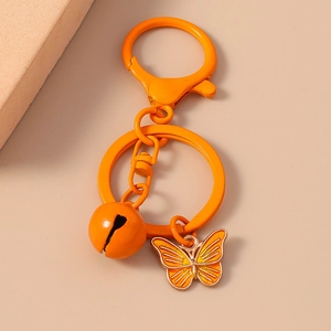 Portachiavi con farfalla in smalto arancione vivace con campanellino e anello in metallo