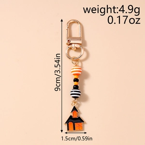 Detail of Halloween beaded keychain with haunted house pendant and gold lobster clasp