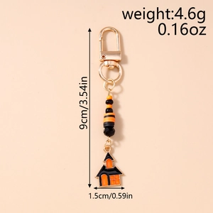 Detail view of Halloween beaded keychain with orange haunted house charm and dimensions