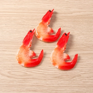 Realistic resin cooked shrimp food models with detailed texture on a light wood surface