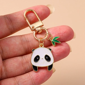 Porte-clés panda doré avec pendentif en émail et breloque en forme de feuille de bambou