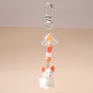 Détails du porte-clés chien floqué blanc avec oreilles oranges et perles colorées