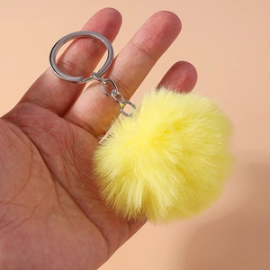 Vibrant yellow 8cm faux fur pompom keychain with silver ring for bag accessories