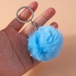 Close-up of fluffy 8cm light blue faux fur keychain with silver metal ring and chain link