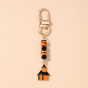 Detail showing Halloween beaded keychain with golden lobster clasp and spooky house charm