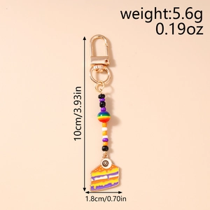 Rainbow cake keychain pendant showing precise measurements of 10cm length and 5.6g weight
