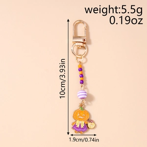 Detail view of Halloween pumpkin keychain with purple dress and bead chain dimensions
