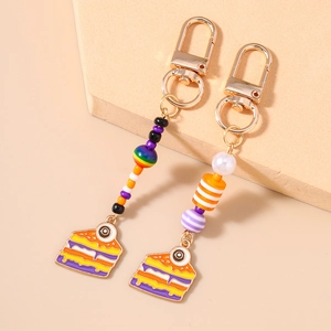 Creepy cute Halloween eyeball cake keychains with colorful beads and golden rings
