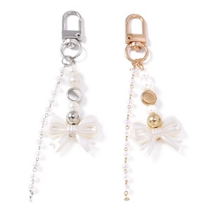 Chic Y2K beaded keychain with white resin bow and faux pearls in gold and silver finish
