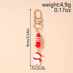 Detailed Christmas snowman keychain featuring red striped beads and gold metal clasp