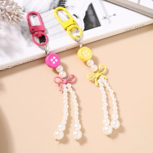 Porte-clés Nœud Papillon à Gland de Künstliche Perles de Mode Pendentif de Bouton en Acrylique Accessoire de Sac Style Doux pour Femmes et Filles