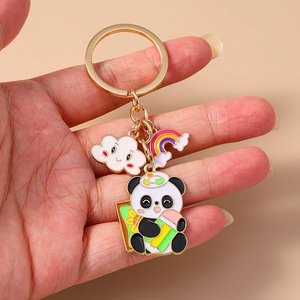 Cute panda keychain with rainbow and cloud charms on a gold plated metal ring