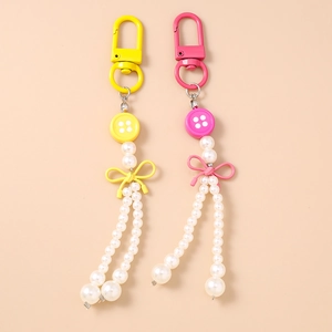 Porte-clés à pampilles en perles à la mode avec nœud coloré et breloques boutons