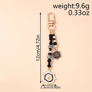 Detail of Halloween spider web keychain with enamel charms and beaded tassel dimensions