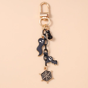 Detail of Halloween keychain with enamel bat, ghost and spider web charms on black beads