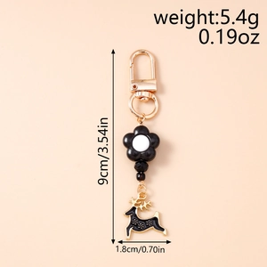 Detailed view of black reindeer keychain with size 9cm and weight 5.4g information