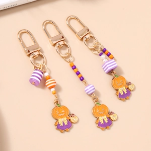 Lot de porte-clés d'Halloween avec perles rayées et breloques de citrouille en métal doré