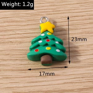 Macro shot of a 23mm green Christmas tree pendant showing weight and size measurements