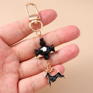 Detail of creative Christmas elk keychain with flower candy charm and black beads