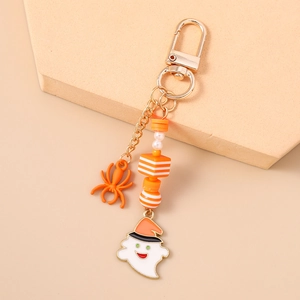 Detail of Halloween ghost and spider keychain with gold lobster clasp and orange beads