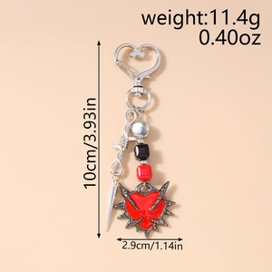 Detailed view of Gothic punk keychain with red enamel heart, thorns, and silver sword hook