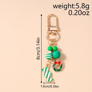 Détail d'un porte-clés de Noël avec pendentifs et dimensions de 8 cm de longueur